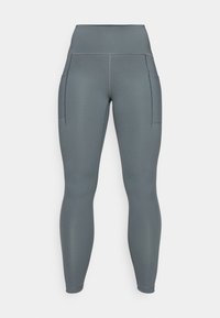 Leggings gris taille haute avec deux poches latérales, fabriqués en tissu extensible, avec des coutures plates et une texture lisse.