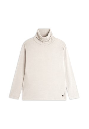 Haut col roulé beige clair en tissu doux, avec des manches longues et une coupe décontractée, comportant un logo discret sur le côté inférieur.