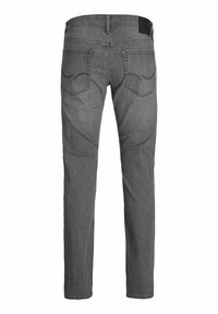 Gray denim jeans with a straight leg design, five pockets, and subtle stitching accents. Features a black brand patch at the waistband.