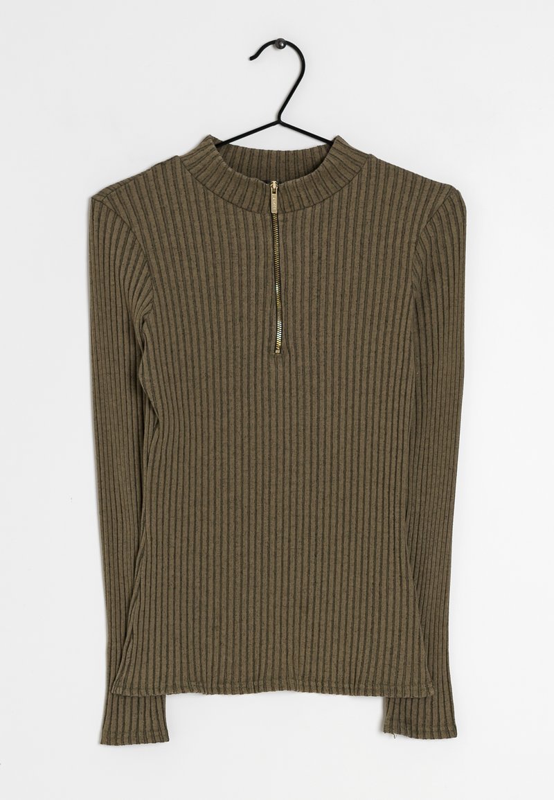 Olivengrön ribbad långärmad topp med hög krage och halv dragkedja. Mjuk textur, figursydd design med sidofickor i fållen.