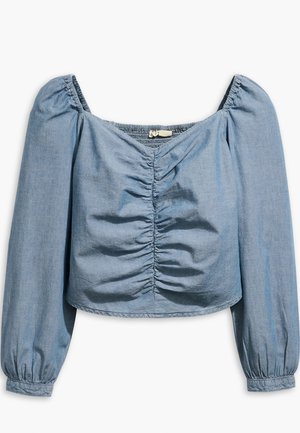 Ανοιχτό μπλε, cropped μπλούζα με μακριά μανίκια σε απαλό τζίν. Διαθέτει μαζεμένο ύφασμα στο μπροστινό μέρος και ελαστικό ντεκολτέ και μανσέτες.