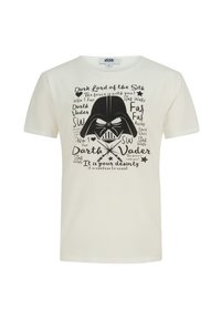 Crème katoen t-shirt met een grote zwarte afbeelding van Darth Vader, omringd door verschillende tekst elementen en sterrenaccenten rond het ontwerp.