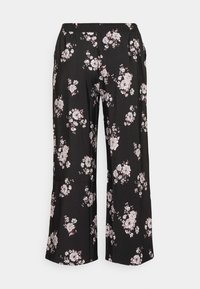 Svarta byxor med vida ben och ett blommönster i rosa och vitt. Resårlinning, lätt tyg och lös passform för komfort.