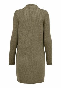 Long-sleeve, knitted sweater in olive green. Features a ribbed texture, slightly oversized fit, and side slits at the hem for ease of movement.