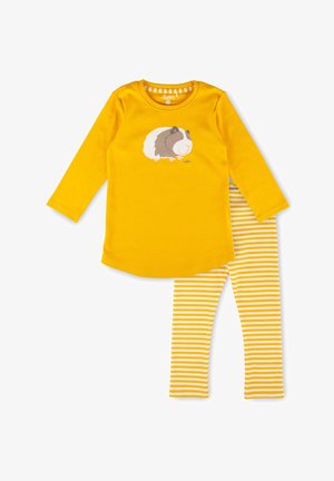 Yellow long-sleeve top with a guinea pig graphic paired with white and yellow striped leggings in a children's clothing set.