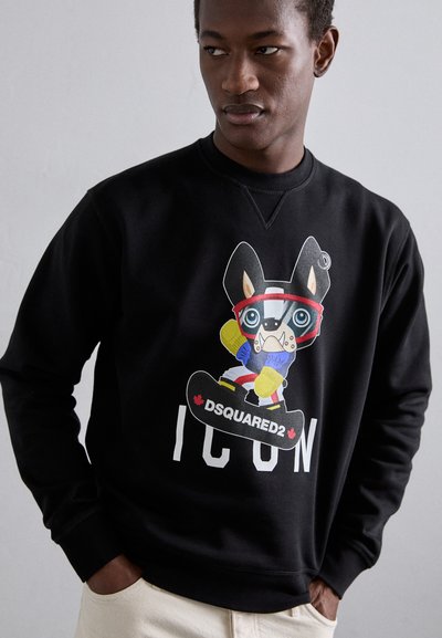 Black sweatshirt featuring a graphic of a cartoon dog in sporty gear, with "DSQUARED2 ICON" text below in white. Simple, casual design.