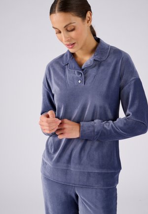 Pull-over en velours bleu marine avec col, quatre boutons et texture côtelée. Il dispose de manches longues et d'un coupe décontractée.