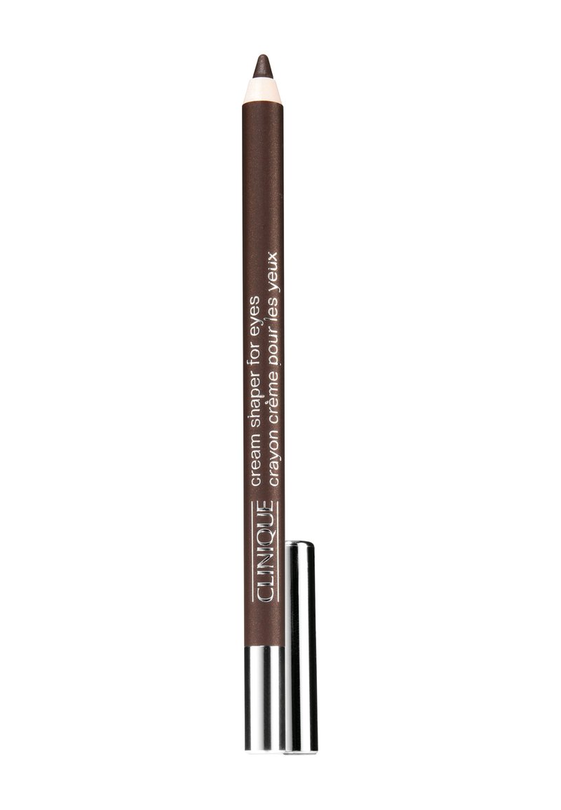 Crayon eyeliner crème marron avec une pointe effilée, boîtier métallique argenté à la base et texte blanc sur l'étiquette. Texture lisse pour une application.