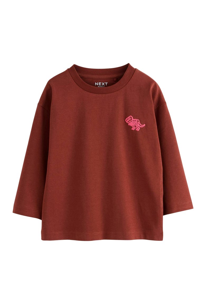 Rostfarbener Langarm-T-Shirt mit einem pinkfarbenen Dinosaurier-Graphic auf der linken Brust und einem gerippten Ausschnitt.
