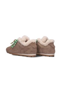 Brown suede sneakers with a fluffy cream lining, featuring green and white patterned laces, and a textured rubber sole for traction.