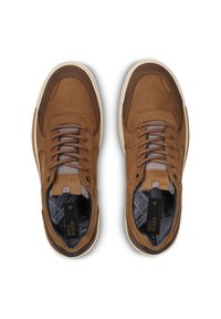 Brown leather sneakers featuring mesh accents, round laces, and a textured sole. Interior has a patterned lining with branding details.