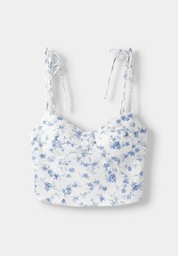 White floral crop top with light blue flower patterns, featuring adjustable tie straps and a structured bodice. Smooth fabric texture.