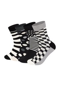 Ensemble de quatre paires de chaussettes avec des motifs : rayures, pois, lignes ondulées et carreaux dans des couleurs noir, gris et blanc. Matière en mélange de coton.