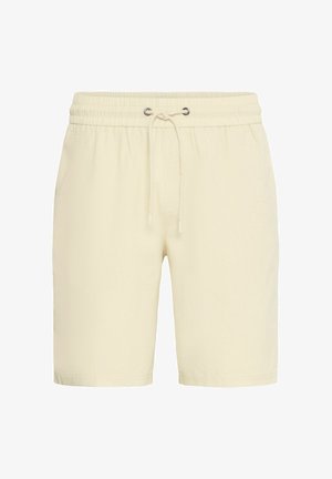 Beige shorts with an elastic waistband, drawstring closure, and side pockets. Soft texture, above-knee length, and no visible patterns.
