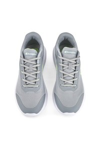 Gray athletic shoes with a mesh upper, prominent lacing system, and a white sole. Features green accents on the sides and branded tongue.