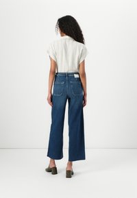 TOM TAILOR DENIM TTMIJA CULOTTE - Platėjantys džinsai - used mid stone blue denim