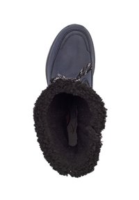 Maritieme laars met een gladde bovenkant, zwarte pluizige voering aan de opening en een getextureerde zool. Beschikt over een vetersluiting en een ronde neus.