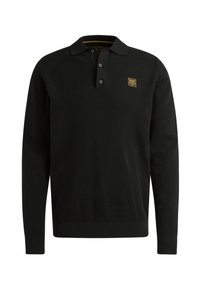 Zwarte polo met lange mouwen van textuurstof. Voorzien van een drieknoopsluiting en een klein geel logo op de borst.