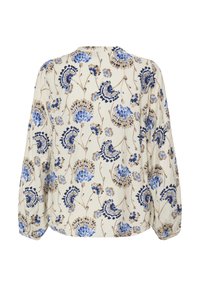 Kvetinová blúzka s krémovým pozadím, zdobená modrými a hnedými kvetinovými vzormi. Voľný strih s dlhými rukávmi a okrúhlym výstrihom.