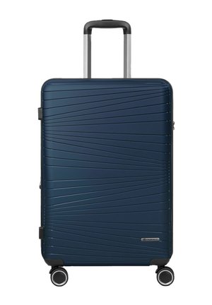 Valise rigide bleu foncé avec des lignes texturées en diagonale, quatre roues pivotantes et une poignée télescopique étendue.