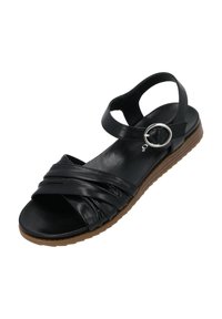 Schwarze Leder-Sandale mit kreuzförmigem Riemen-Design, rundem silbernem Hardware-Akzent und brauner Gummisohle, die eine strukturierte Optik bietet.