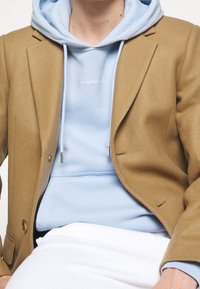 sandro Jersey con capucha - light blue