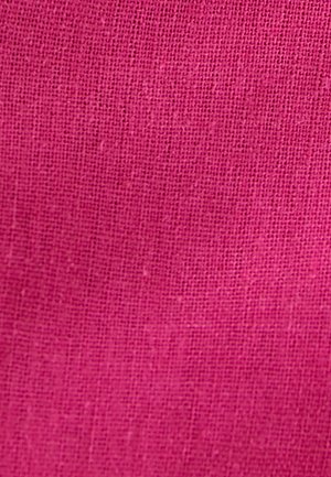 Pink fabric with a textured, woven pattern. The material appears lightweight and breathable, suitable for clothing or upholstery.