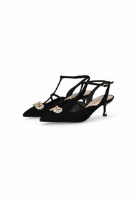 Mustad nubukist slingback-kontsud terava ninaga, millel on dekoratiivne kuld- ja kristallaktsent esiosal ning õrn kont.