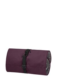 Borsa da stoccaggio arrotolabile di colore viola, realizzata in tessuto resistente, dotata di una tracolla nera e di una fibbia in plastica per una chiusura sicura. L'interno è grigio.