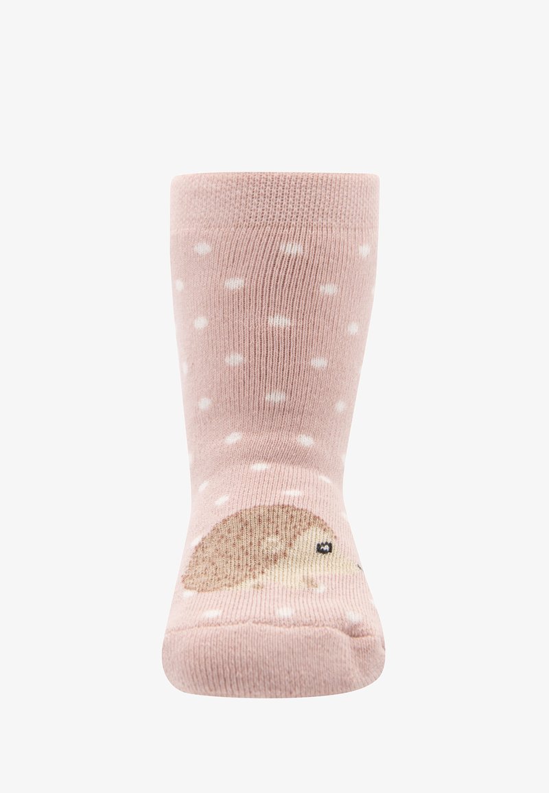 Różowe skarpetki w białe kropki, z wzorem jeża po boku. Wykonane z miękkiego materiału, są elastyczne i sięgają do kostki.