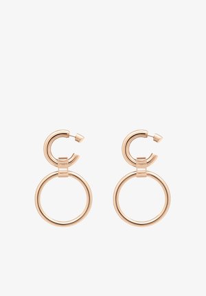 Cirkulære hoops øreringe i rosaguld metal, med et lagdelt design der inkluderer en mindre løkke over en større ring. Glat, skinnende finish.