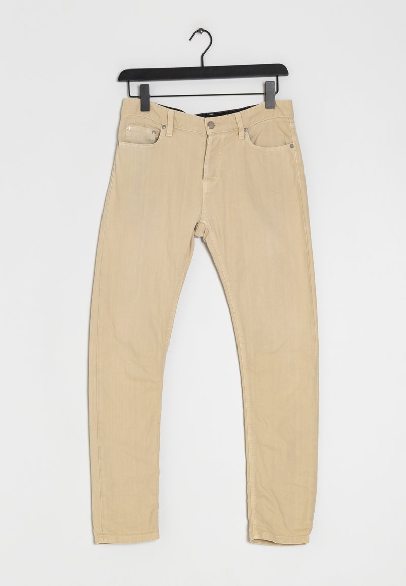 Jean beige en coton extensible avec une coupe slim, cinq poches et des accessoires métalliques. Le tissu présente une texture lisse et une couleur neutre.