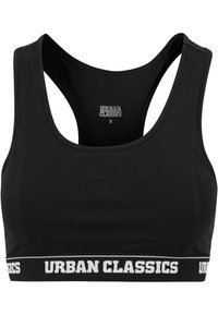 Crna sportska brusnica od glatkog materijala, s izrezom u obliku žlice, dizajnom s racerback leđima i elastičnom trakom s natpisom "URBAN CLASSICS" u bijelim slovima.