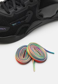 Black mesh athletic shoe with sleek design and textured panels, accompanied by colorful, spiral shoelaces in rainbow hues.