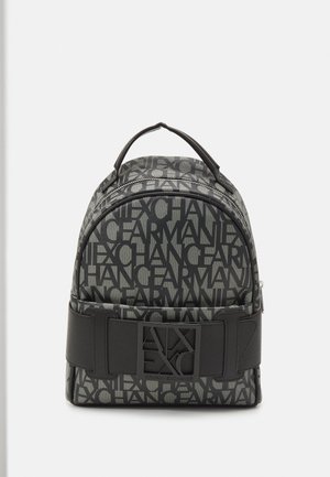 Compact gray and black Armani Exchange backpack with repeated logo pattern, top handle, front zipper pocket, and wide black strap with logo plaque.