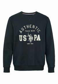Sweat bleu marine avec texte blanc « AUTHENTIC USPA », logo joueur de polo au centre, poignets et ourlet côtelés, col rond.