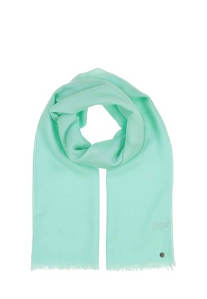 Mintgrüner Schal aus weichem Stoff, mit fransigen Kanten und einem kleinen metallischen Logo-Akzent. In einer Schlaufenform drapiert.