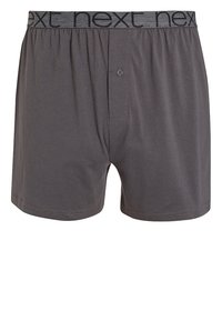 Grå bomullsboxershorts med en mjuk midje som är märkt "next." Har en knappstängning framtill och en slät textur. Enkelt design.