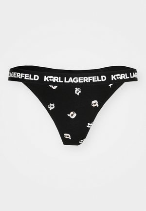 Mustmustelased mustad aluspüksid, millel on lai valge elastik, millel on kiri "KARL LAGERFELD". Näitab lõbusaid disaine heledates värvides üle kogu pinnale.