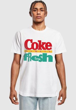 White cotton t-shirt featuring a colorful graphic design with "Coke" in red and "fresh" in green, accented by a yellow line.