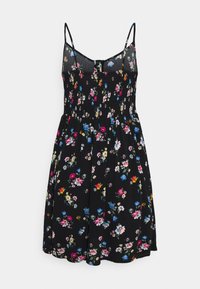 Robe noire sans manches avec fines bretelles, corsage froncé et petit motif floral coloré en bleu, rose, blanc et jaune.