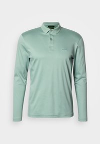 Világoszöld hosszú ujjú galléros póló. Sima anyagból készült, gallérral, kétgombos patenttal és hímzett logóval a mellkason.