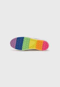 Multicolored rubber shoe sole featuring a zigzag tread pattern. Colors include pink, orange, yellow, green, blue, and purple.
