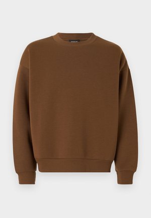 Sweat-shirt marron à col rond, poignets et bord-côte côtelés, coupe décontractée et texture lisse. Aucun motif ou détail matériel visible.