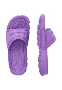 Purple rubber slides featuring a thick, textured sole, rounded toe, and wide upper strap with embossed logo detail. Lightweight design.