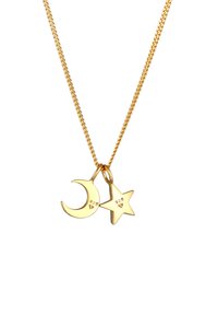 Collana in tono dorato con charm a forma di luna crescente e stella. Entrambi i charm sono in metallo lucidato con punzoni incisi "925".