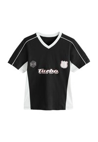 Černobílý fotbalový dres s krátkým rukávem a výstřihem do V, se lila růžovým logem "Turbo" a štítkovou nášivkou, obšitý bílým stehem.