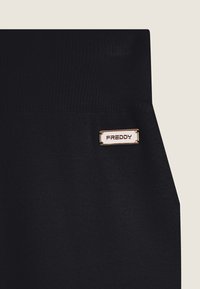 Freddy WENEA - Pantalones deportivos - black
