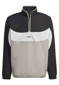 Vindtät jacka med kvartsdrog i svart, vitt och ljusgrått. Har elastiska ärmslut, sidofickor och en liten logotyp på bröstet.