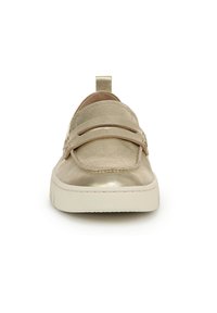 Gold metallic slip-on shoes featuring a smooth fabric upper, dual decorative straps, and a white rubber sole with textured tread.